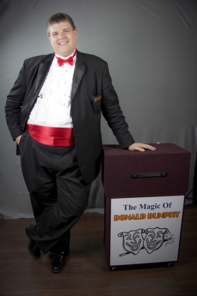 Magician Donald Dunphy and his magic table.